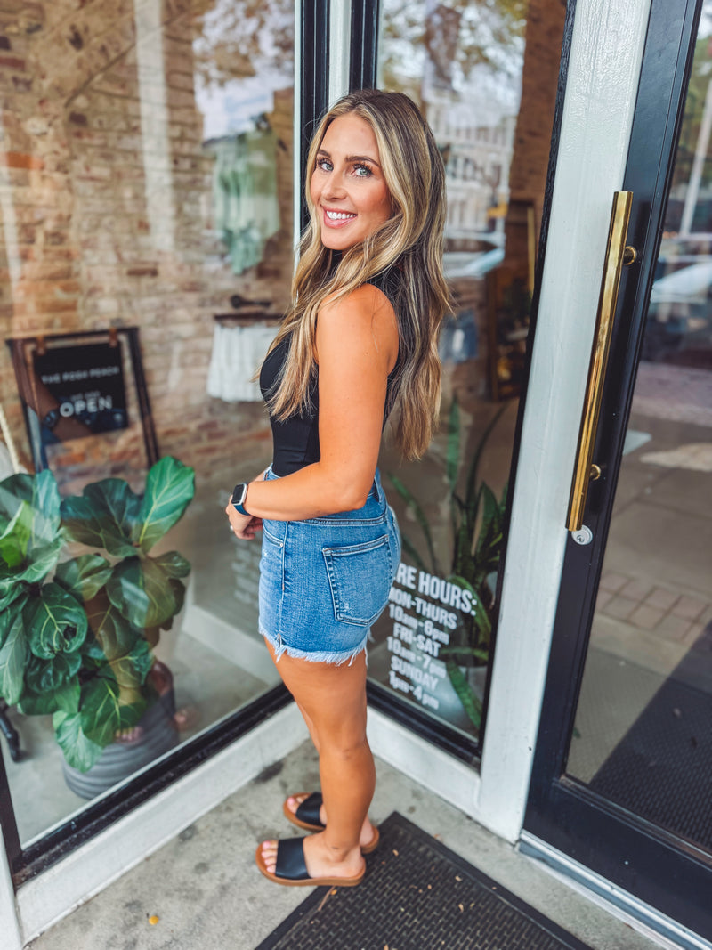 Medium wash side slit shorts